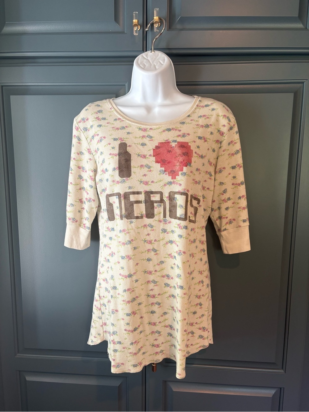 Y2K thermal top floral print and a large graphic that reads "I ❤️ NERDS